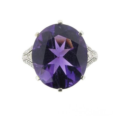 Appraisal: An amethyst and diamond ring The oval shaped amethyst is