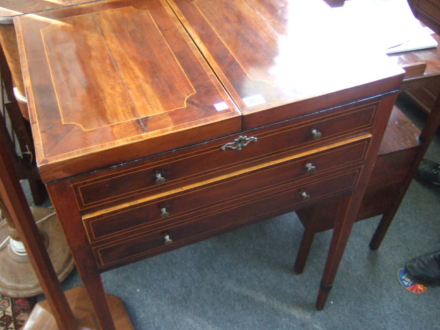 Appraisal: A George III mahogany gentlemans dressing table the fold-out top