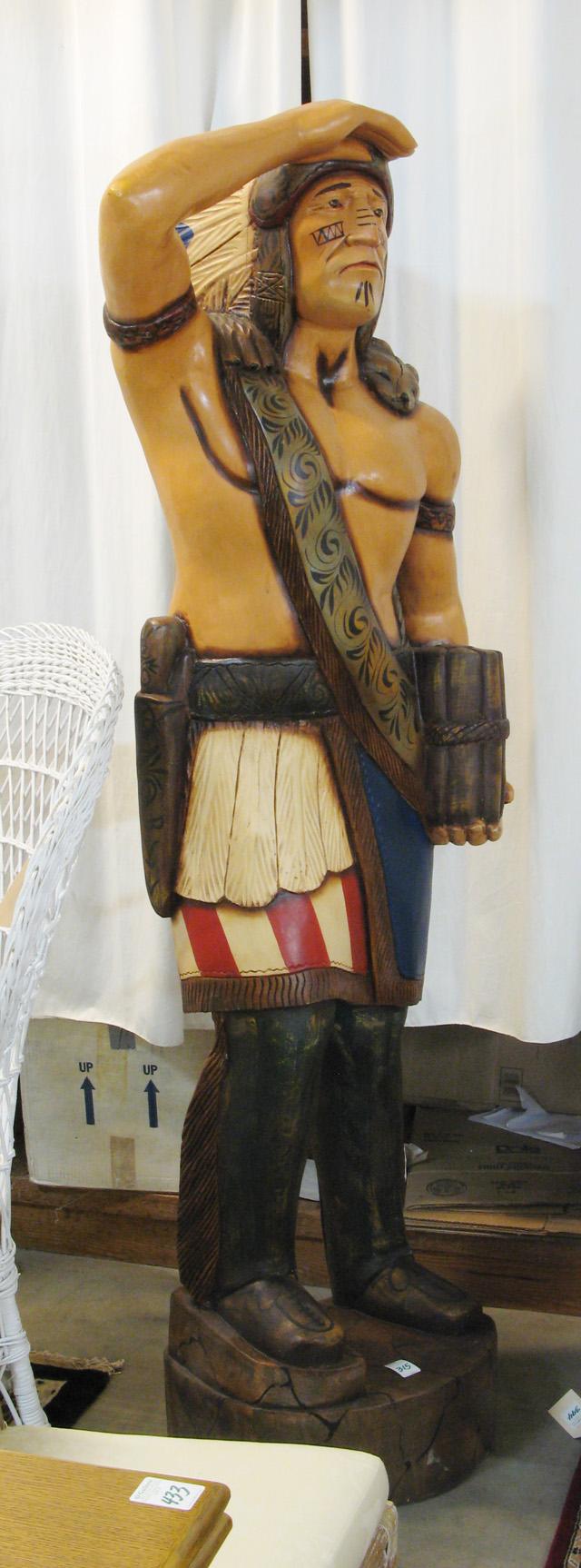 Appraisal: A CARVED AND PAINTED WOOD CIGAR STORE INDIAN the larger-than-life-size