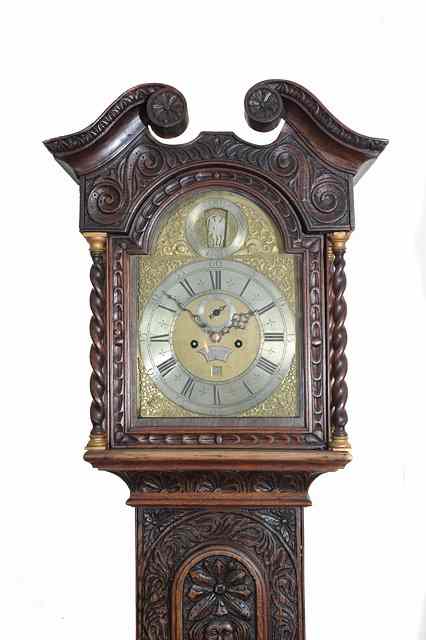 Appraisal: AN EIGHT DAY LONGCASE CLOCK the break arch brass dial