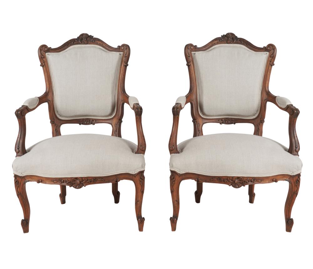 Appraisal: PAIR OF ROCOCO-STYLE FAUTEUILSeach mahogany carved with flowers foliage and