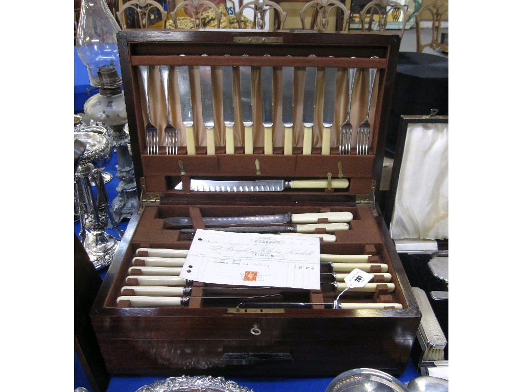 Appraisal: Part cutlery set in mahogany canteen with original receipt