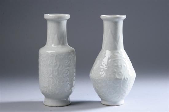 Appraisal: TWO CHINESE WHITE GLAZED PORCELAIN VASES Each with molded foliate