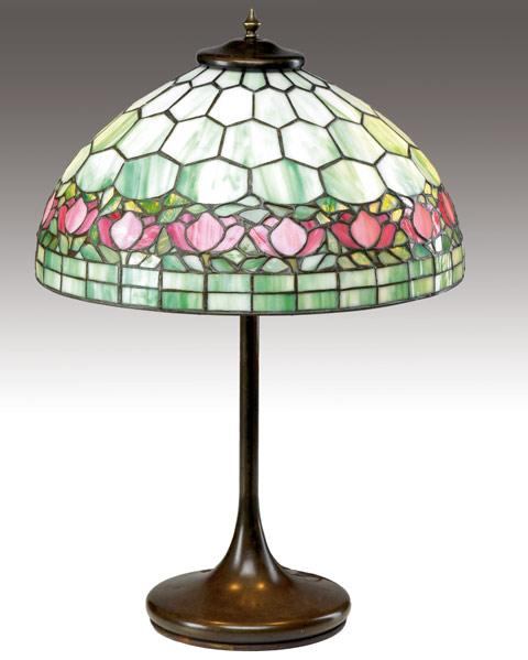 Appraisal: UNIQUE Table lamp with a leaded glass shade bordered in