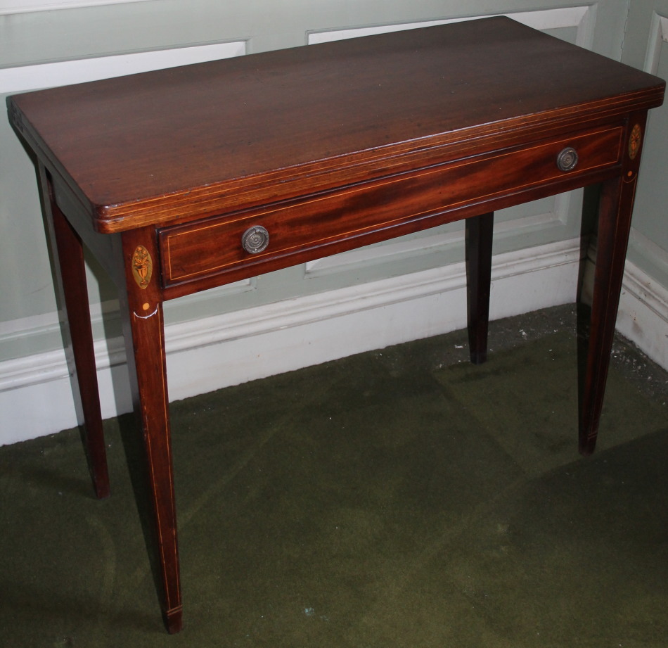 Appraisal: An early thC mahogany tea table the rectangular top with