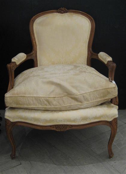 Appraisal: Pair Louis XV style walnut fauteuils The curved foliate carved