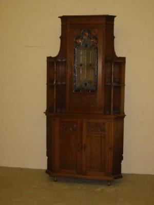 Appraisal: A NORTH EUROPEAN WALNUT STANDING CORNER CUPBOARD the cavetto moulded