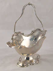 Appraisal: A silver swing handled shaped oval basket on stand with