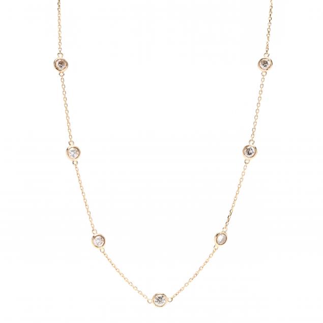 Appraisal: GOLD DIAMOND STATION NECKLACE Delicate rolo link chain bezel set