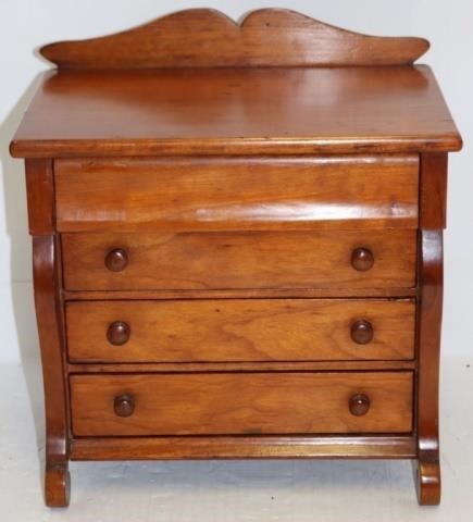 Appraisal: TH C MINIATURE CHEST OF DRAWERS CHERRYWITH BACK-SPLASH HIGH WIDE