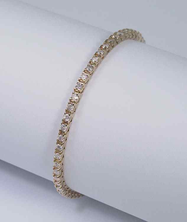 Appraisal: K DIAMOND LINE BRACELET K yellow gold bracelet contains round