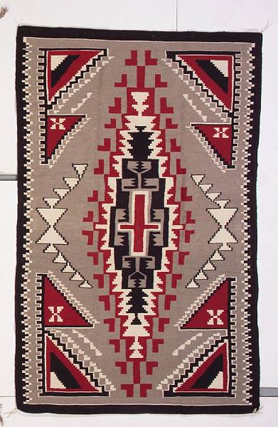 Appraisal: A Navajo rug With elaborate central stepped and winged diamond