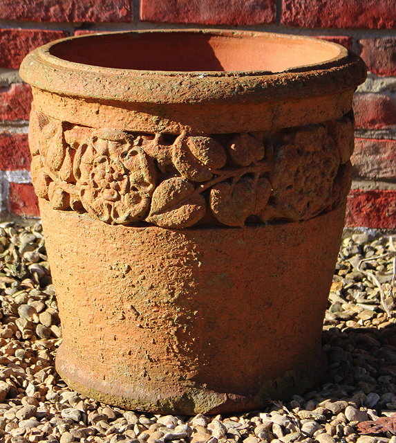 Appraisal: AN EDWARDIAN TERRACOTTA CYLINDRICAL GARDEN PLANTER with a band of