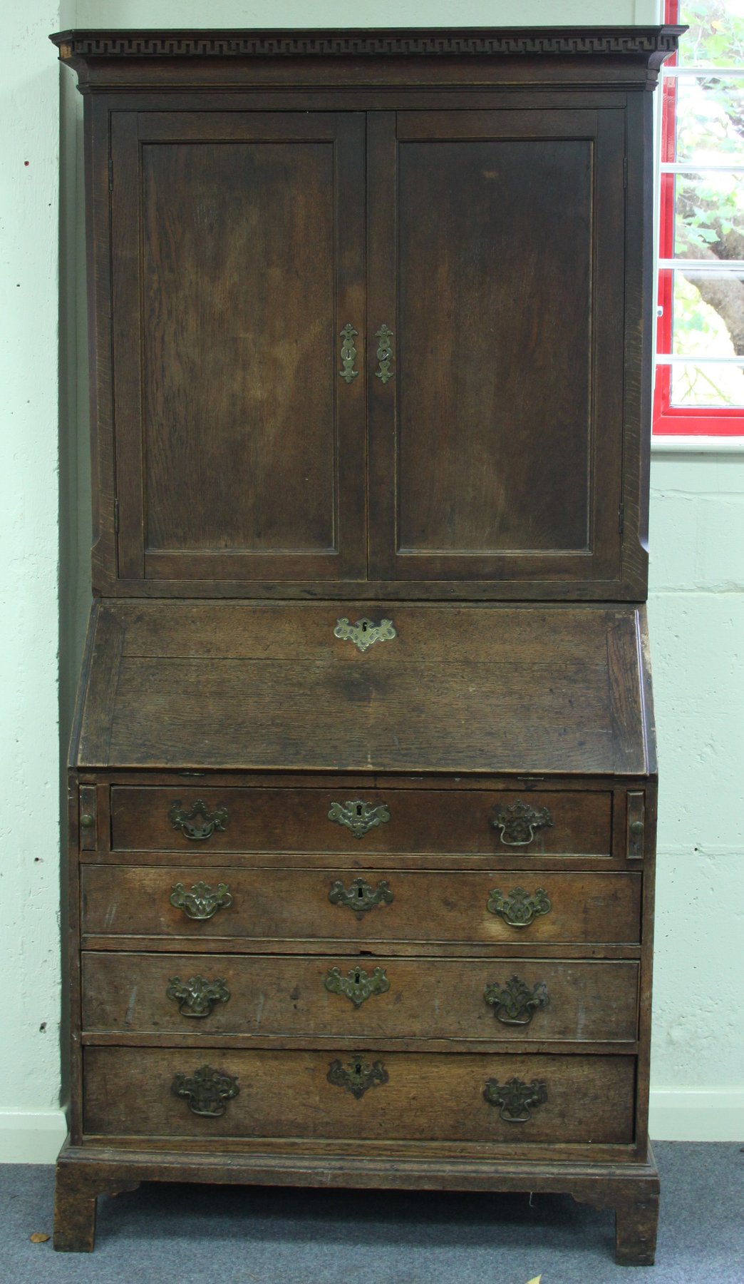 Appraisal: A George III oak bureau bookcase with cabinet above a