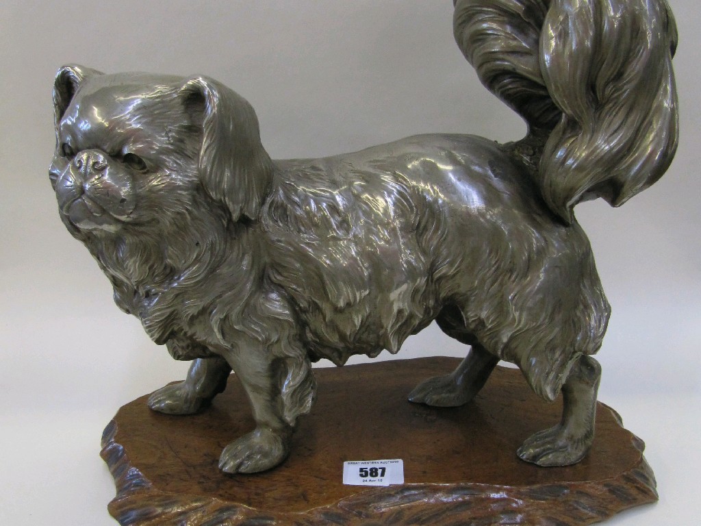 Appraisal: Oriental white metal figure of a Pekingese dog on wooden