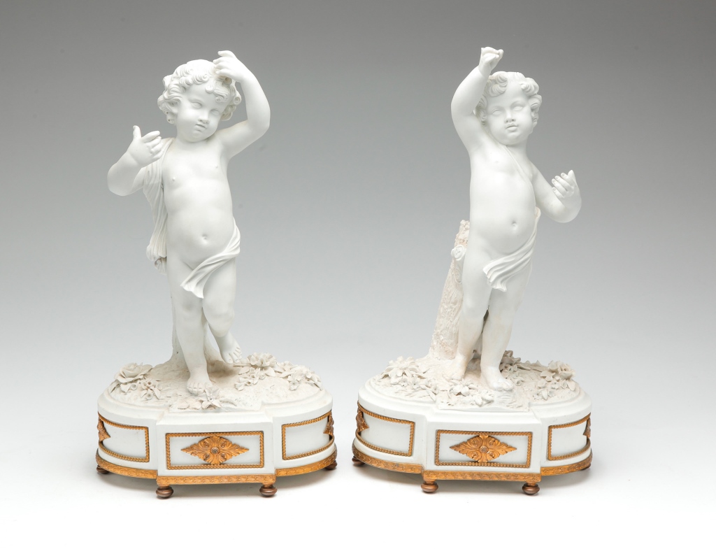 Appraisal: Nineteenth century bisque Full-form putti atop floral plinths with brass