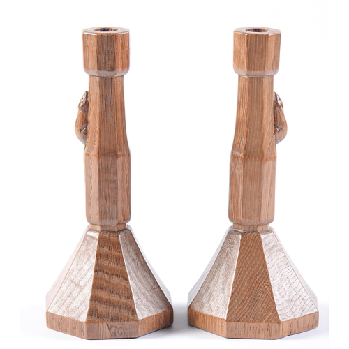 Appraisal: A pair of Robert 'Mouseman' Thompson oak candlesticks of octagonal