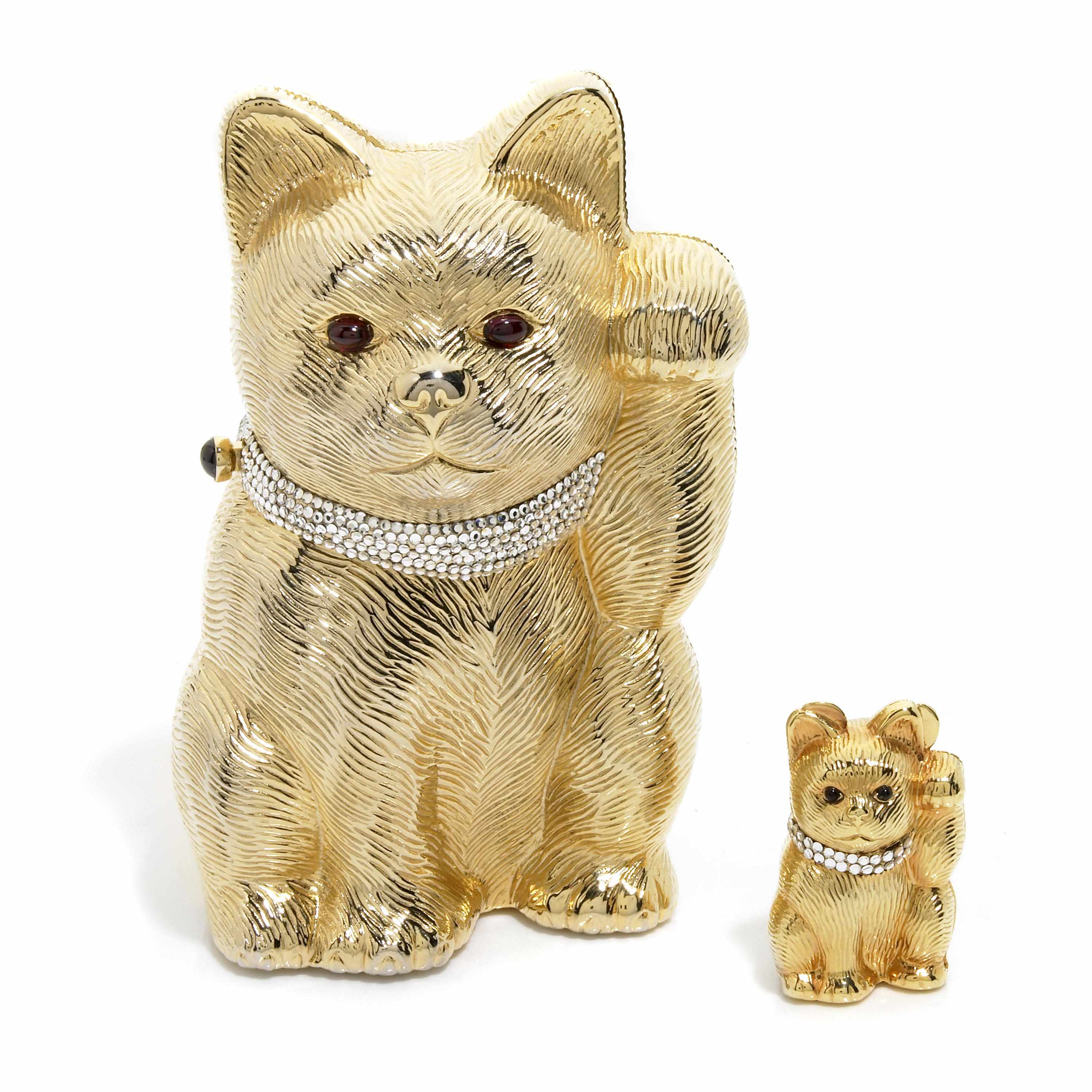 Appraisal: A gold colored metal and silver crystal ''Maneki Neko'' Good