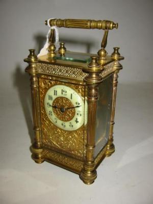 Appraisal: A GILT BRASS CARRIAGE CLOCK the single barrel movement with