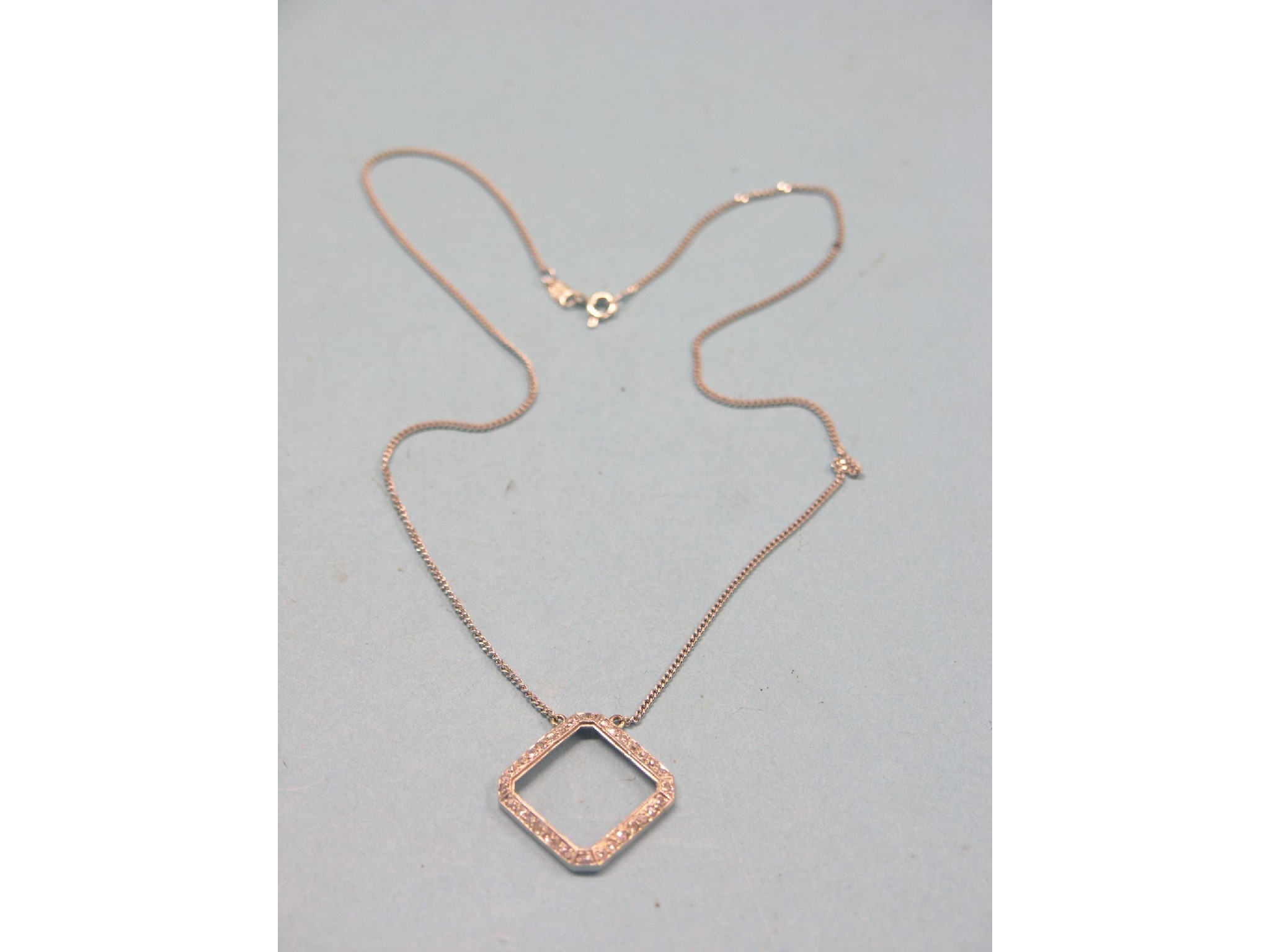 Appraisal: An ct white gold necklace open square pendant set numerous