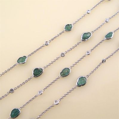 Appraisal: An emerald and diamond set chain necklace the shaped and