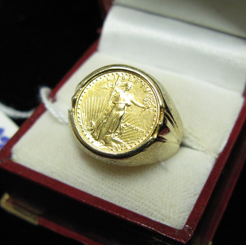 Appraisal: MAN'S GOLD COIN AND FOURTEEN KARAT GOLD RING bezel set