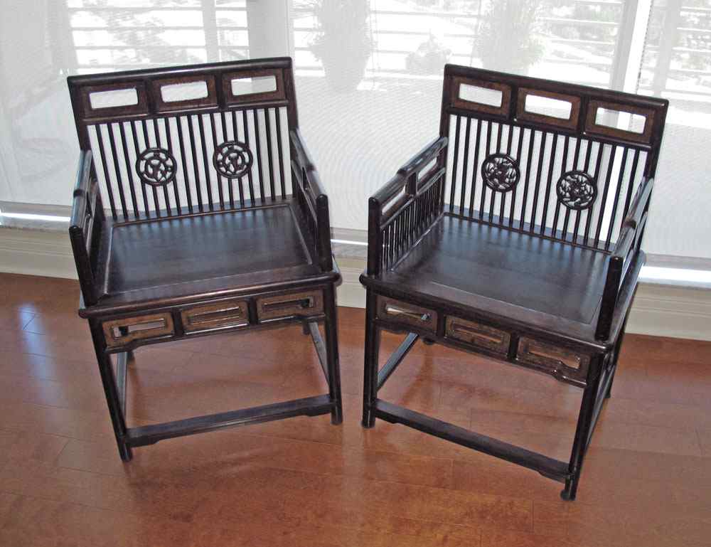 Appraisal: PAIR CHINESE ARM CHAIRS Carved and pierced back arm rests