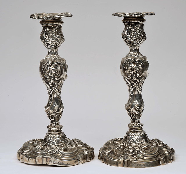 Appraisal: A PAIR OF WILLIAM IV LOADED SILVER CANDLESTICKS and drip