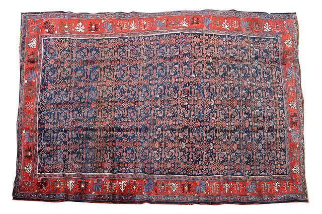 Appraisal: A BIDJAR BLUE GROUND CARPET with central stylised foliate decoration