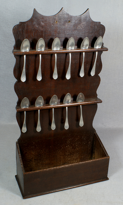 Appraisal: Oak Georgian spoon rack with unmarked th c pewter teaspoons