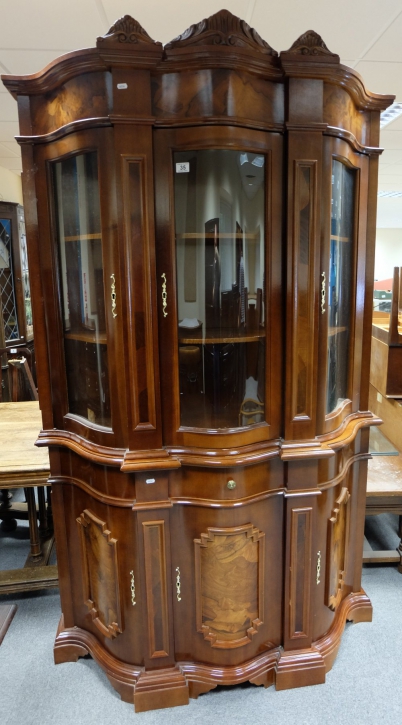 Appraisal: Reproduction burr walnut serpentine fronted door display cabinet