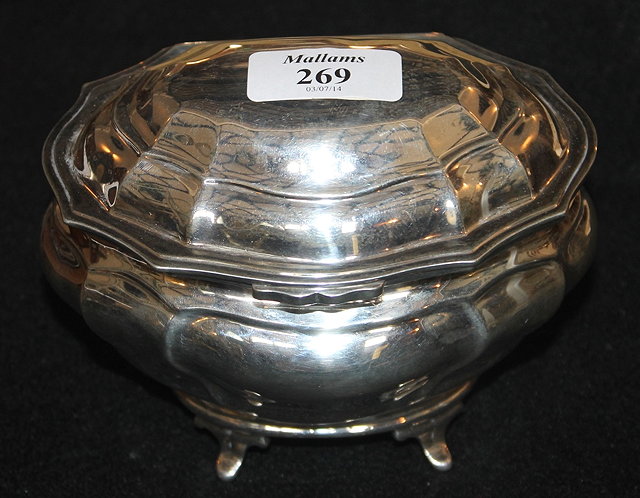 Appraisal: A GEORGIAN STYLE SILVER TEA CADDY of oval baluster form