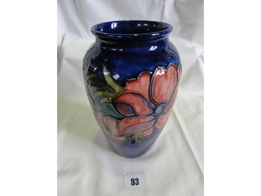 Appraisal: A Moorcroft Pottery blue ground vase of tall shouldered form