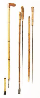 Appraisal: A late th century bamboo sword stick with a turned