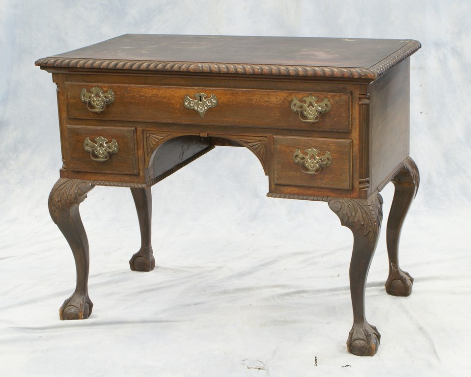 Appraisal: Carved mahogany Chippendale style dressing table with garooned edge acanthus