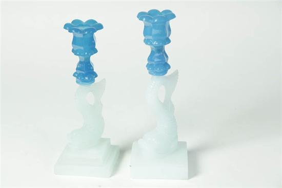 Appraisal: TWO DOLPHIN CANDLESTICKS American rd quarter th century Sandwich glass