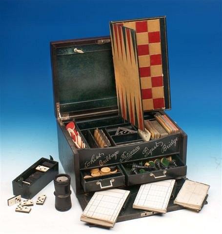 Appraisal: A leather cased games compendium with silver mounts consisting of