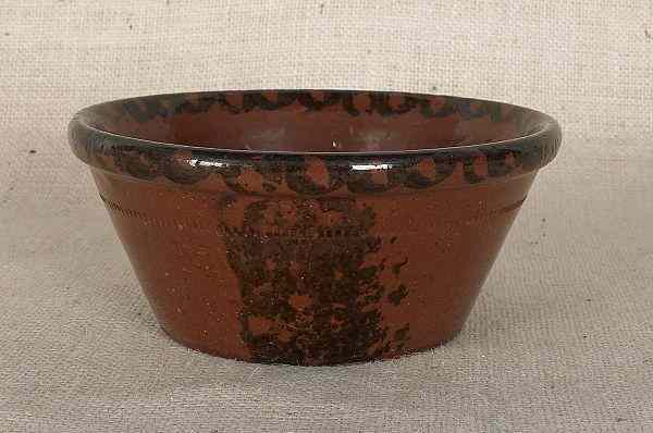 Appraisal: Pennsylvania redware bowl th c with manganese decoration h dia