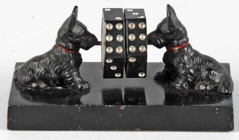 Appraisal: Cast Iron Scottie Dogs Dice Spinner Description Made by Hubley