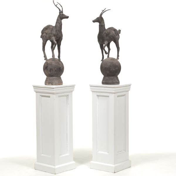 Appraisal: TWO IRON ANTILOPE SCULPTURES ON WHITE PEDESTALS x sculpture Two