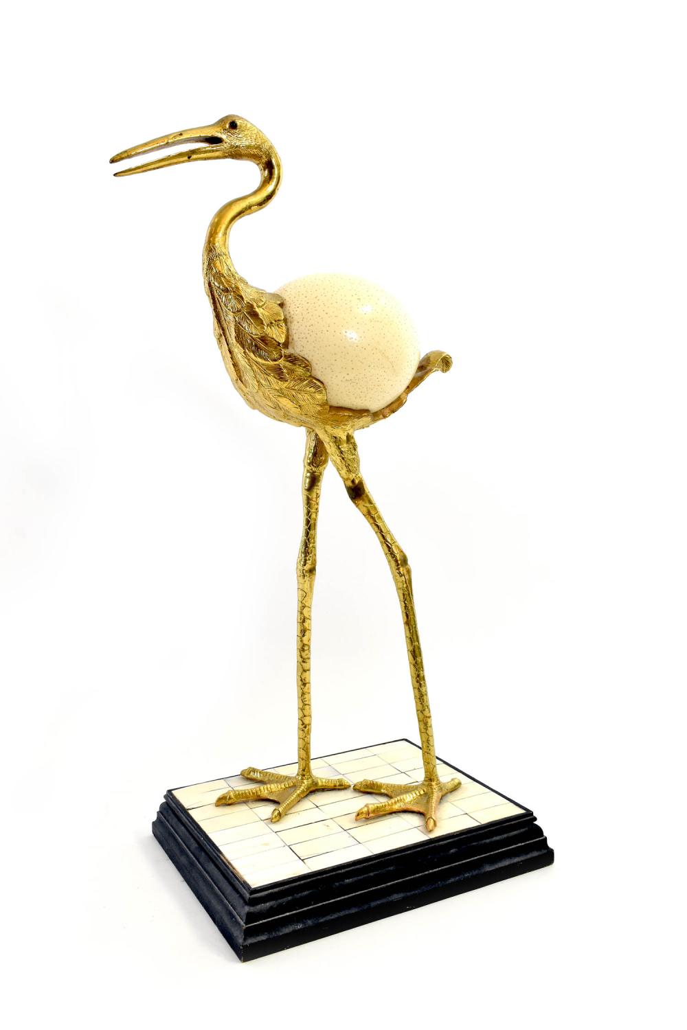 Appraisal: BRASS AND OSTRICH EGG BIRDThe egg forming the body the