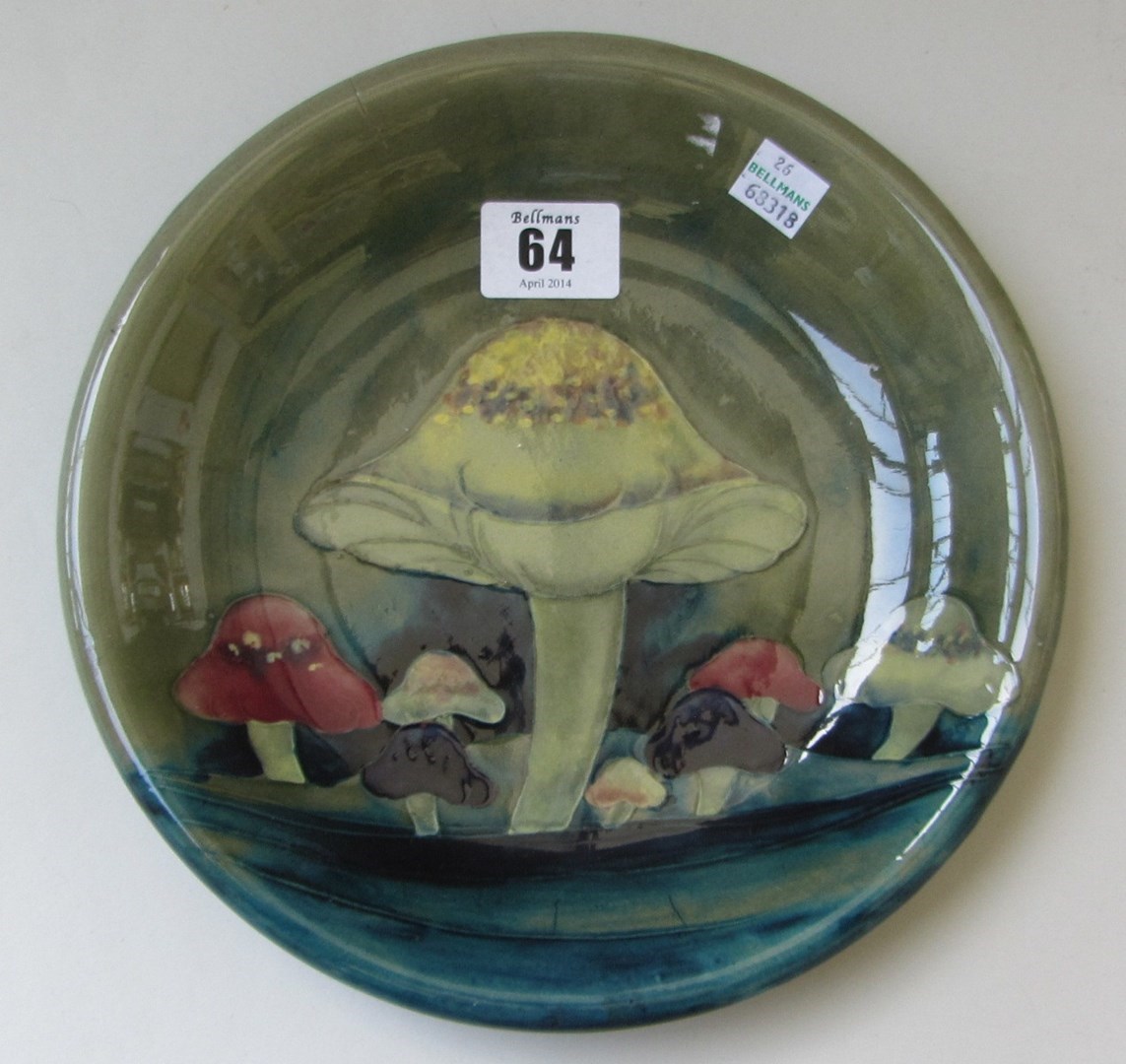 Appraisal: A Moorcroft shallow bowl decorated in the Claremont toadstool pattern