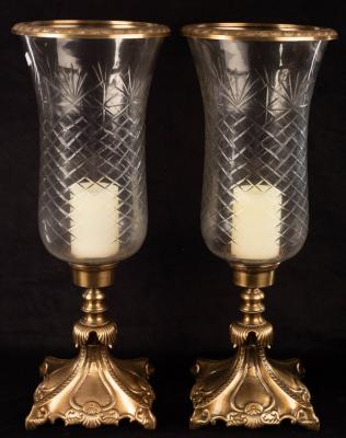 Appraisal: A pair of cut glass and gilt metal candle holders