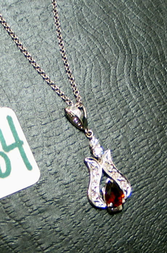 Appraisal: ALMANDITE GARNET DIAMOND AND WHITE GOLD PENDANT NECKLACE The K