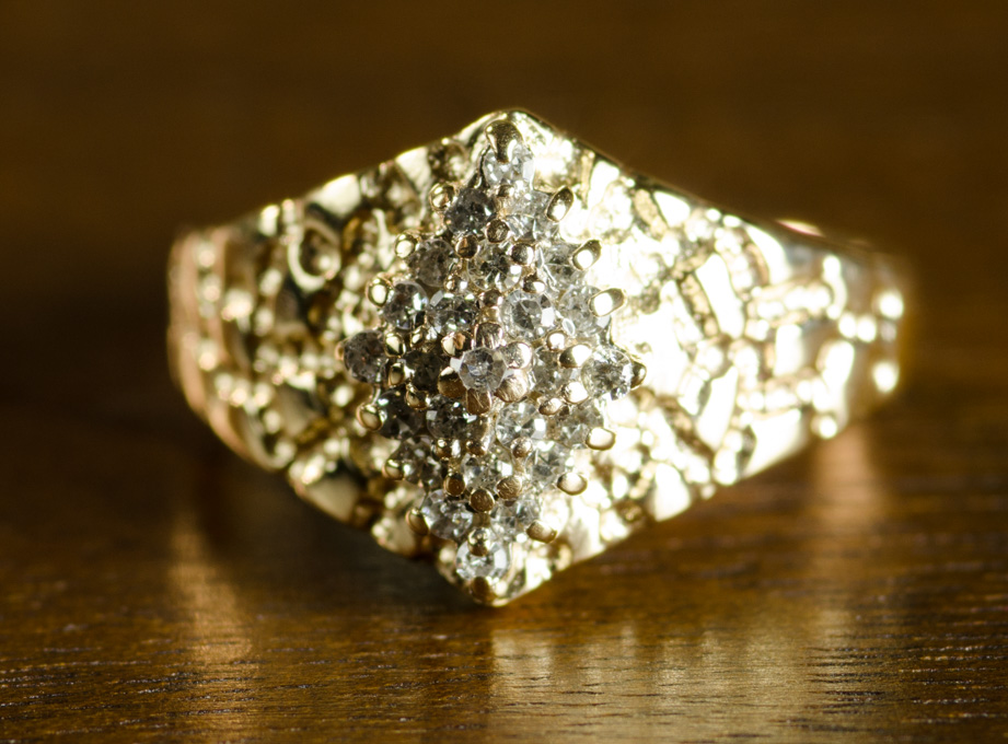 Appraisal: DIAMOND AND FOURTEEN KARAT GOLD CLUSTER RING The gold nugget