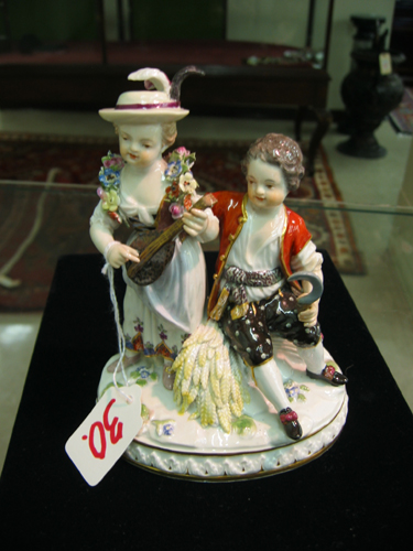 Appraisal: MEISSEN PORCELAIN FIGURAL GROUP young woman standing playing instrument with