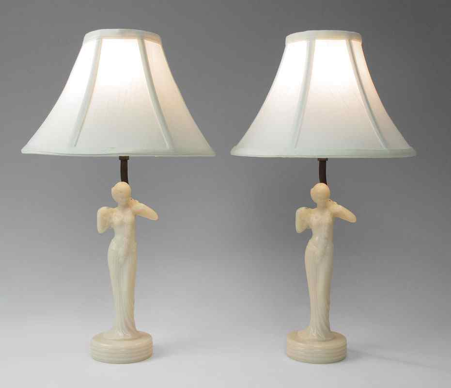 Appraisal: PAIR OF ALADDIN ART DECO FIGURAL LAMPS Pink Alacite glass