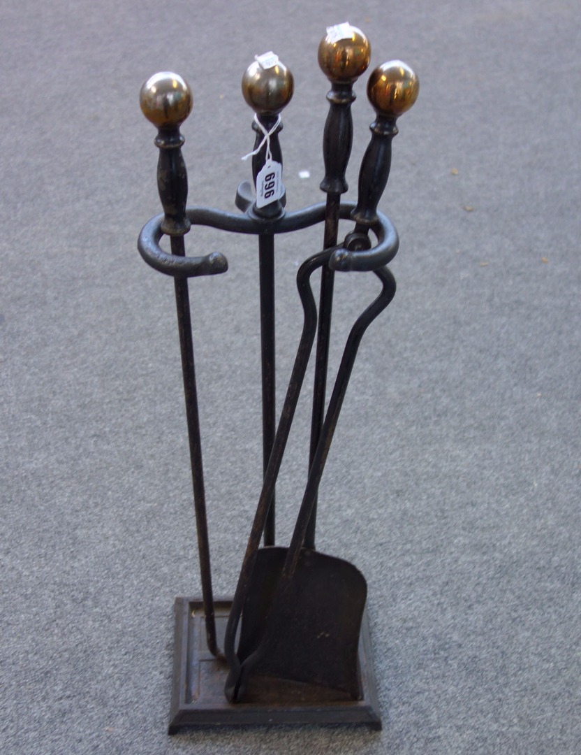 Appraisal: A set of ebonised steel fire tools and stand with