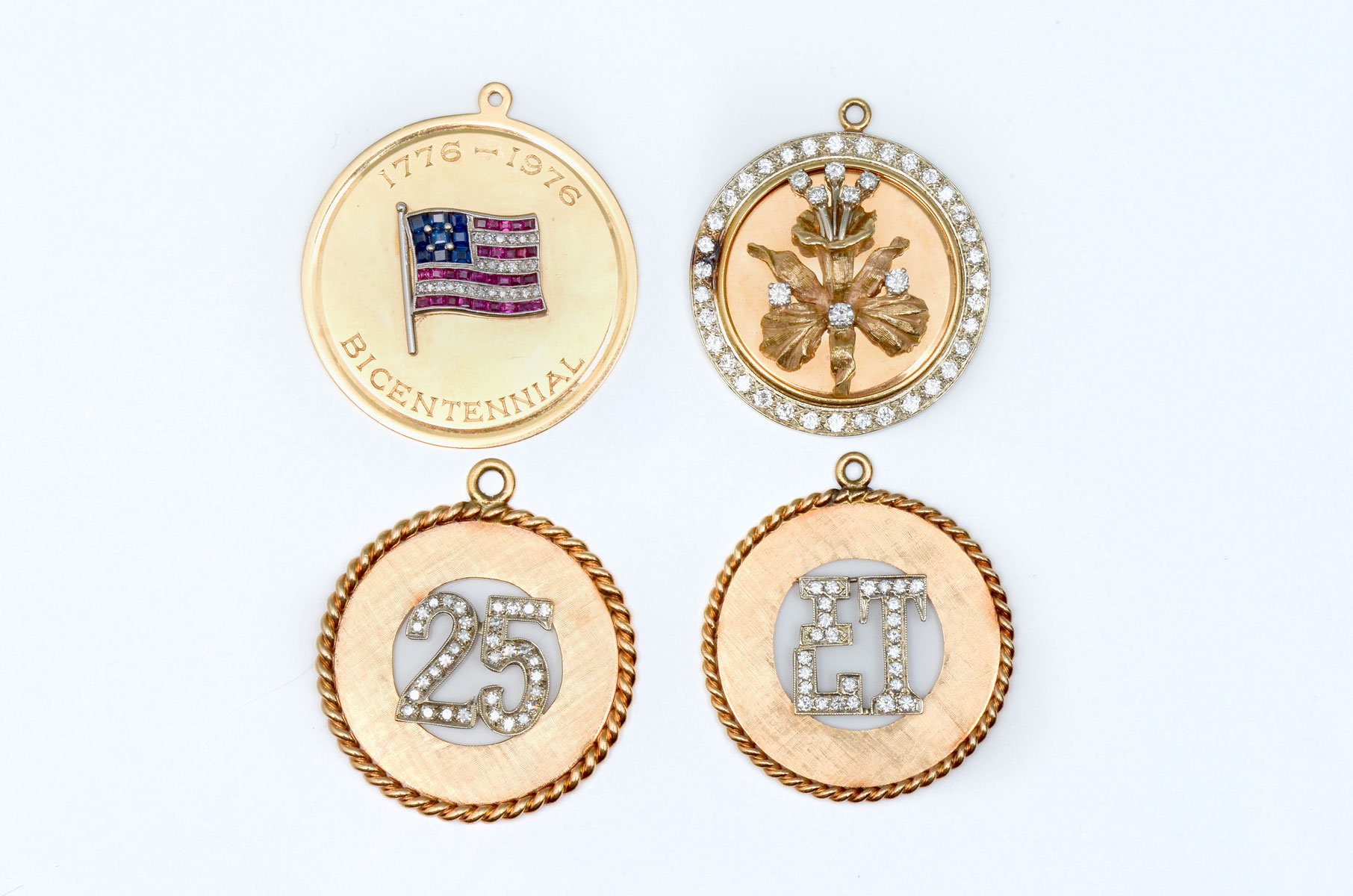 Appraisal: K CIRCLE CHARMS K yellow gold circle pendants charms are