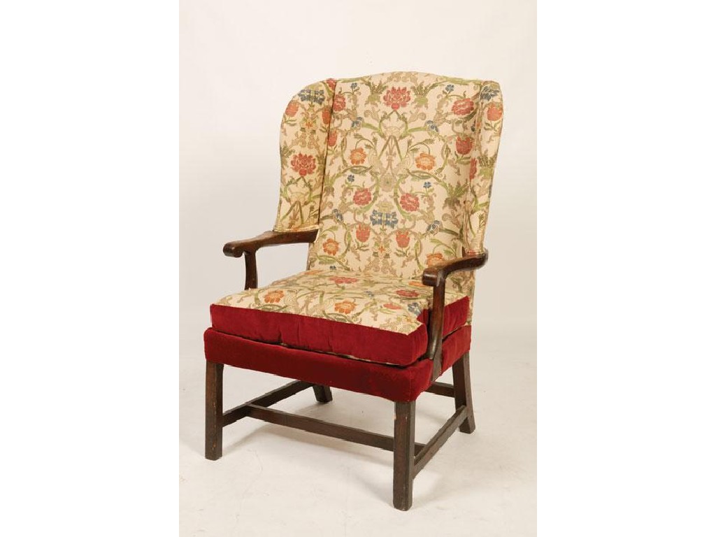 Appraisal: A GEORGE II OAK AND UPHOLSTERED ARMCHAIR the raised back